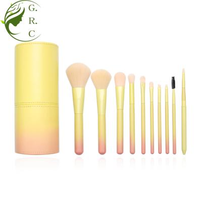 China Angular Blush 10pcs Custom Wood Handle Wooden Nylon Hair Gradient Pink Yellow Makeup Brush Set With Cylinder Case for sale