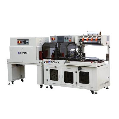 China Brand New Famous CLOTHING Style Cardboard Heat Tunnel Shrink Wrapping Machine For Notebook for sale