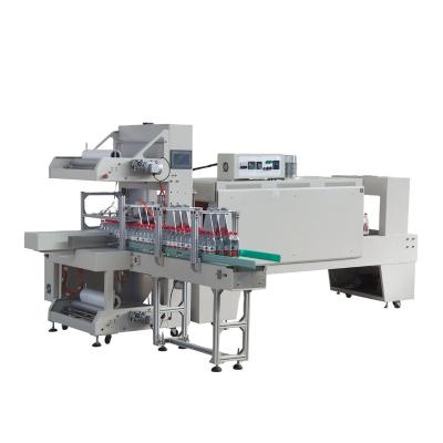 China Material And Sealing Type Bottle Shrink Wrap Machine CLOTHING Plastic Packaging Machine for sale