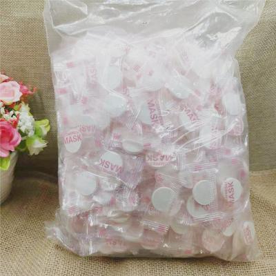 China Disposable Moisturizer Candy Compressed Mask Nonwoven Fabric Paper Light Absorption Fast Bulk Independent Packaging for sale