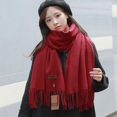 China Fashion factory wholesale fashion scarf with tassel solid color cashmere women shawl custom for sale