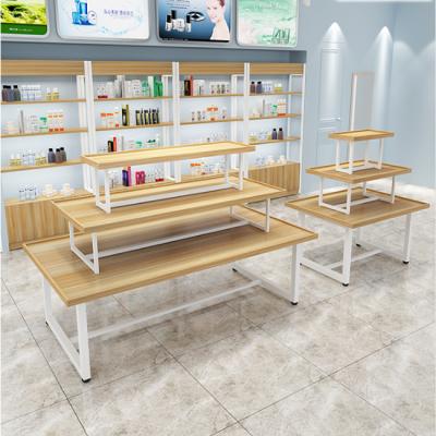 China Customized three tier double sided display table perfect for cosmetic bags clothes goods storage rack for sale