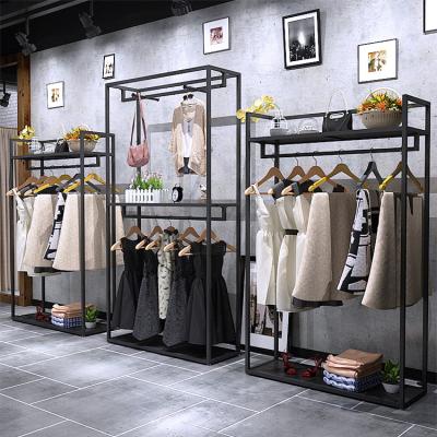 China Metal Side Modern Gold Style Hangers Retail Dress Shop Display Clothing Rack With Side Hangers for sale