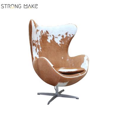 China Lounge Chairs Famous Designer Comfortable Full Cowhide Armchair Modern Antique Living Room Chairs for sale