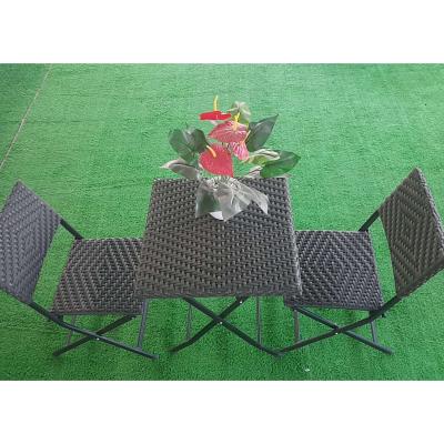 China Black Rattan Furniture Garden Chairs Chairs Rattan Table And Chair Easy Carry Foldable Dining Chair Set for sale