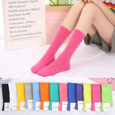 China HY-574 QUICK DRY Classic Sports Color Candy Long Tube Socks Famous Designer Unisex Couple Brand Socks For Men And Women for sale