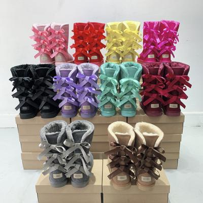 China Fashion Trend Factory Direct Wholesale Winter Sheepskin Fur Warm Boots Waterproof Furry Uggh Snow Boots For Women for sale