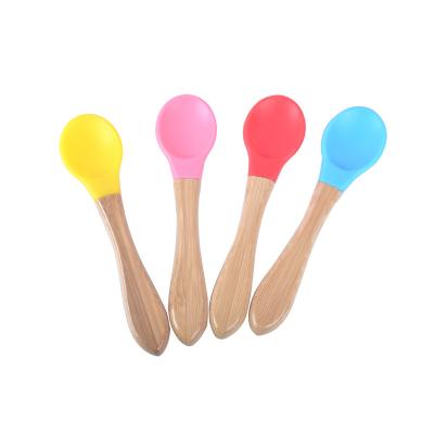 China First Stage Food Safety Lightweight Natural Bamboo Non-Toxic Silicone Colored Spoon For Toddlers Wooden Baby Feeding Practicing Spoon for sale