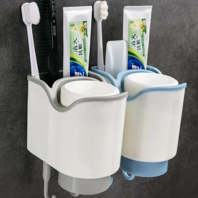 China Stocked Plastic Toothbrush Holder With Gargle Cup Wall Suction Cups Stretch Shaver Toothbrush Dispenser Bathroom Accessory Set for sale