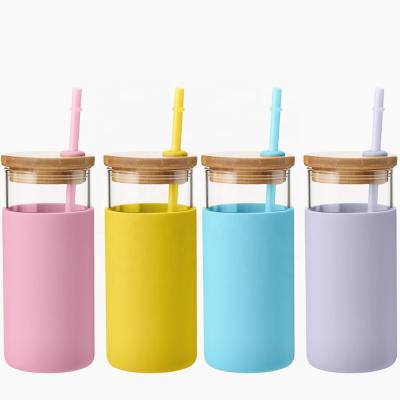 China 2019 Trends Sustainable Eco Friendly Bamboo Lid Glass Water Bottle With Silicone Sleeve And Straw for sale