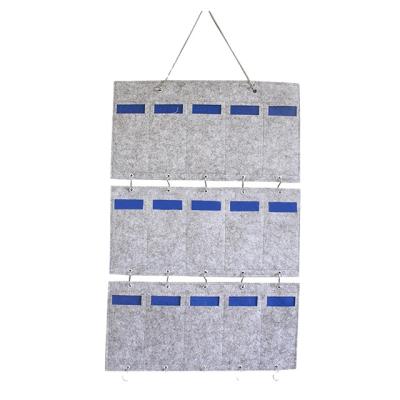 China Multifunctional Home Decoration Sustainable Wall Storage Container Felt Living Room Glass Storage Bag for sale