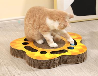 China Large Sunflower Cat Scratch Board Bell Corrugated Cat Toy Corrugated Cathole Rotating Ball Cat Toy Pet Supplies for sale