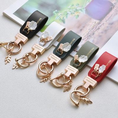 China Small Car Gift Leather Metal Keychain French Luxury Car Key Chain Pendant Lovely Leather Key Chain For Girl Gift for sale