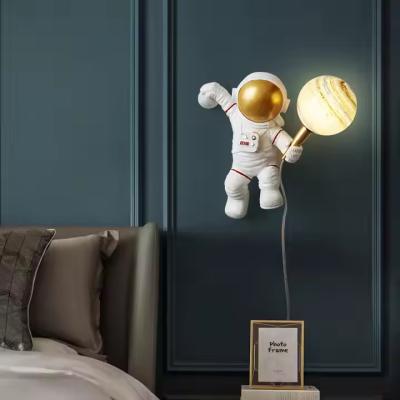 China Modern Astronaut-Themed LED Wall Lamp Hot Selling Resin Decorative Light for Kids Bedroom Living Room for sale