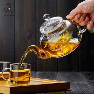 China DianTong 600ml 800ml borosilicate glass teapot pyrex glass viable heat resistant clear teapot with glass infuser and warmer for sale