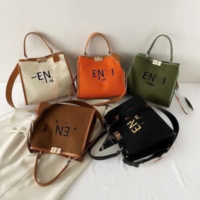 China Fashion New Style Brand Design Luxury PU Shoulder Handbag Tote Bags Small Material Purses For Women 2022 for sale