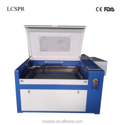 China Laser Engraving CO2 60w 4060 Laser Engraving And Cutting Machine With Auto Focus And 15mm Axis Square X/Y Linear Guide Rail for sale