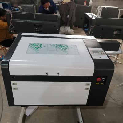 China laser engraving ruida 6445 4060 EFR 80w CO2 laser engraving and cutting machine have good price for sale