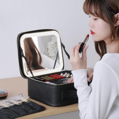 China Fashion Custom Logo Lighted Vanity Makeup Bag Cosmetic Case With Mirror Make Up Led Travel Organizer for sale