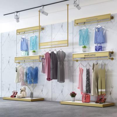 China For Garment Shop Modern Fashion Clothing Rack Gold Clothes Showroom Wall Mounted Display Racks for sale