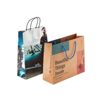 China Wholesale Cheap Price Biodegradable Luxury Brand Famous Gift Printed Shopping Paper Bag With Your Own Logo for sale