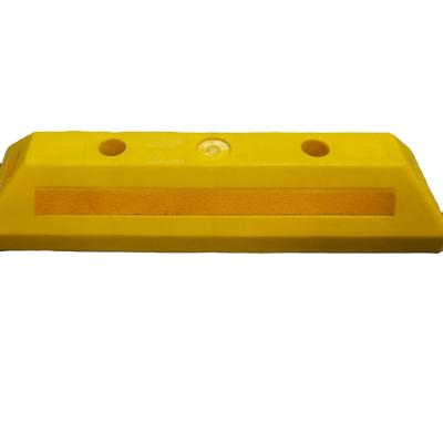 China Durable Plastic Wheel Stoppers Parking Wheel Stoppers Vehicle Wheel Chocks for sale