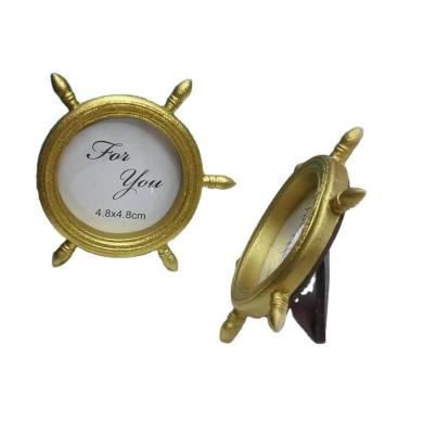 China Resin Ywbeyond Gold Ship Wheel Photo Frame Holder /Place Card Holder Wedding Souvenirs Bridal Shower Favors for sale