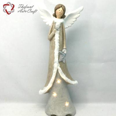 China Christmas Crafts LED Christmas Light Crafts Holding Star Angel Figurine Decoration for sale