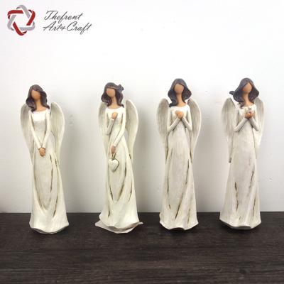 China Europe wholesale home deco figurines wing polyresin white angel with brown hair for sale