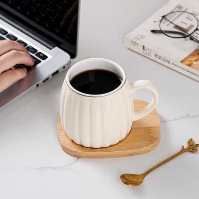 China Viable Wholesale White Cups White Enamel Cup Modern Gold Handle Coffee Mug for sale