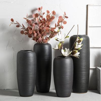 China Contemporary Black Cylindrical Vases Oriental Home Decor Ribbed Waist Quality Ceramic Vases for sale