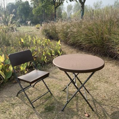 China Modern American popular high quality outdoor plastic folding round table with chair set for sale