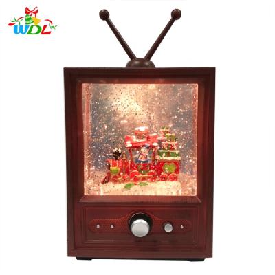 China Gift & Christmas decoration craft supplies Christmas train TV stage design water lantern snow music glass swirl ball led glitter snow globe for sale