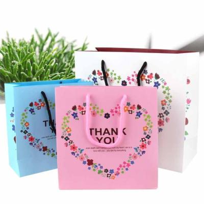 China Recyclable Wholesale Custom Color  Portable Paper Bag For  Gift Packaging Shopping Promotion Bags for sale