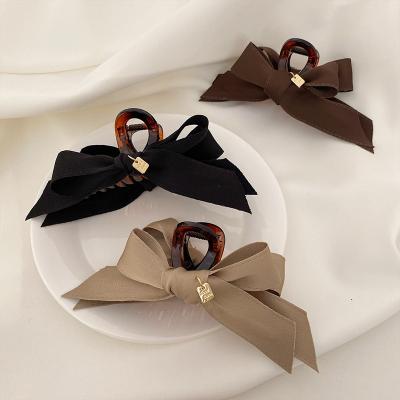 China Korean simple high-grade bow claw cut French Ribbon Grace Acrylic Summer Hair Clip high fashion for sale