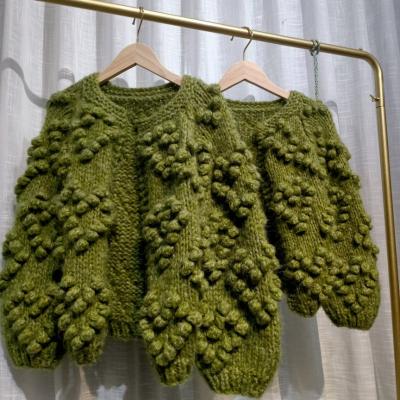 China Knitting Pom Pom Open Cardigan Women Heart Shape Soft Breathable Balls Hand Knit Chunky Olive Cardigan for sale