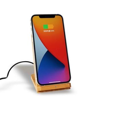 China Multi Function as Phone Holder and Wireless Charger Green Concept OEM Laser Engraving Logo Double Loves QI 10W Fast Charging 2 in 1 Bamboo Holder Stand Phone Wireless Charger for sale