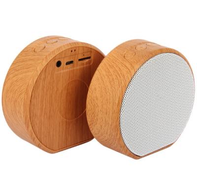 China New Design Customized OEM Logo Stylish Phone Function Printing A60 Grain Mini Portable Wooden FM Radio Wireless Speaker for sale