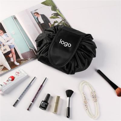 China Low MOQ Cosmetic Tool Storage Bag Customized Logo Round Small Mini Portable Drawstring Makeup Pouch Cosmetic Bag for sale