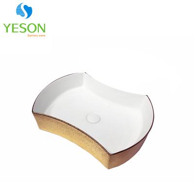 China Modern White With Gold Trim Ceramic Wash Basin Bathroom Basin for sale