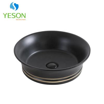 China Whithout Faucet Handmade Black Gold Balance Outdoor Ceramic Wash Basin Hotel Sink for sale