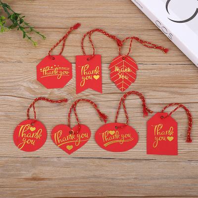 China Custom CLOTHING Hang Tag String Embossed LOGO Gold Foil Printing Wax Square Plastic Cotton Hang Tag Nylon Ball Lock Strings For Garment for sale