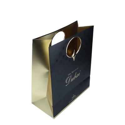 China Recyclable Custom Design Wholesale Cheap Gold Cardboard Paper Bags Gift Packaging Bags With Logos for sale