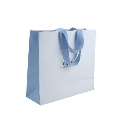 China Recycled Materials With Ribbon Handle Shopping Paper Bag for sale