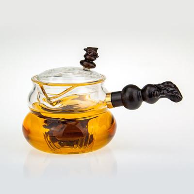 China Online Wholesale Viable Handle Heat Resistant Side Squash Solid Wood Glass Teapot for sale