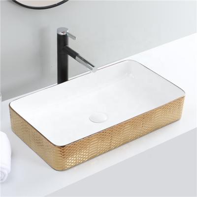 China Modern Gold Bathroom Basin Sink Faucet Gold Luxury White Basin Lavatory Smart Fashion Faucet Gold for sale