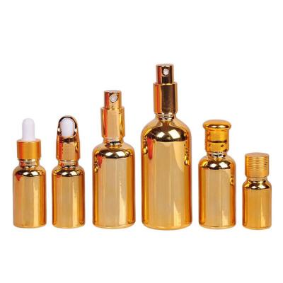 China Personal care 5ml 10ml 15ml 20ml 30ml 50ml 100ml shiny electroplate gold dropper glass bottles for essential oil for sale