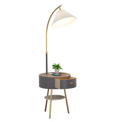 China Modern Nordic creative multifunctional floor lamp with small table and USB wireless charging for sale