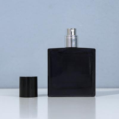 China 30ML bright black perfume sub-bottle, glass empty bottle, high-end portable spray lotion bottle, fine mist for sale