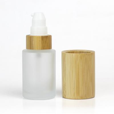 China 30ML/50ML/60ML/100ML/120ML bamboo bottle glass flat shoulder luxury cosmetic packaging bamboo cover for glass spray pump for sale